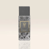 Perfume bottle with geometric design on a beige background at al rashid perfumes qatar