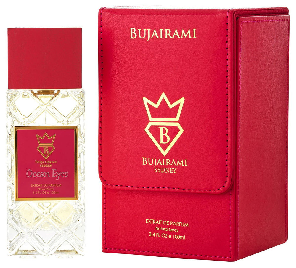 Bujairami Ocean Eyes extrait de parfum bottle next to its red leather box packaging, featuring gold lettering and a crown logo.