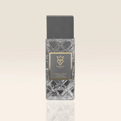 Perfume bottle with geometric design on a beige background at al rashid perfumes qatar