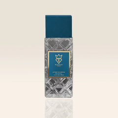 Perfume bottle with decorative design on a beige background