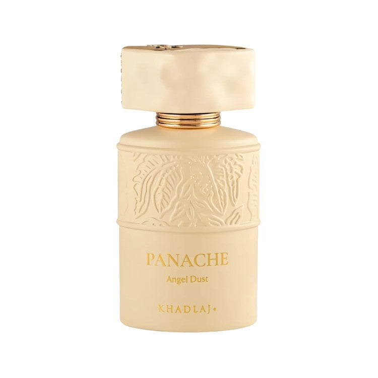 A bottle of KhadlaJ Panache Angel Dust perfume, featuring a matte cream-colored bottle with embossed details and gold lettering, topped with a matching cream cap and gold collar, set against a plain white background.