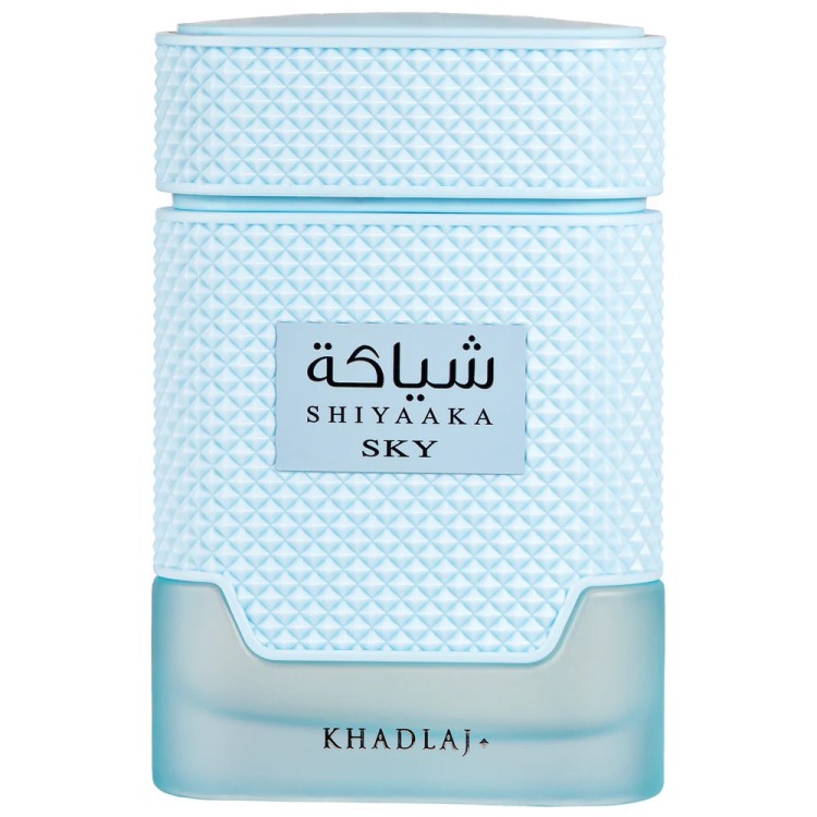 Shiyaaka Sky fragrance bottle by KhadlaJ, featuring a textured light blue cap and body with a frosted light blue base, and Arabic text on the front label.